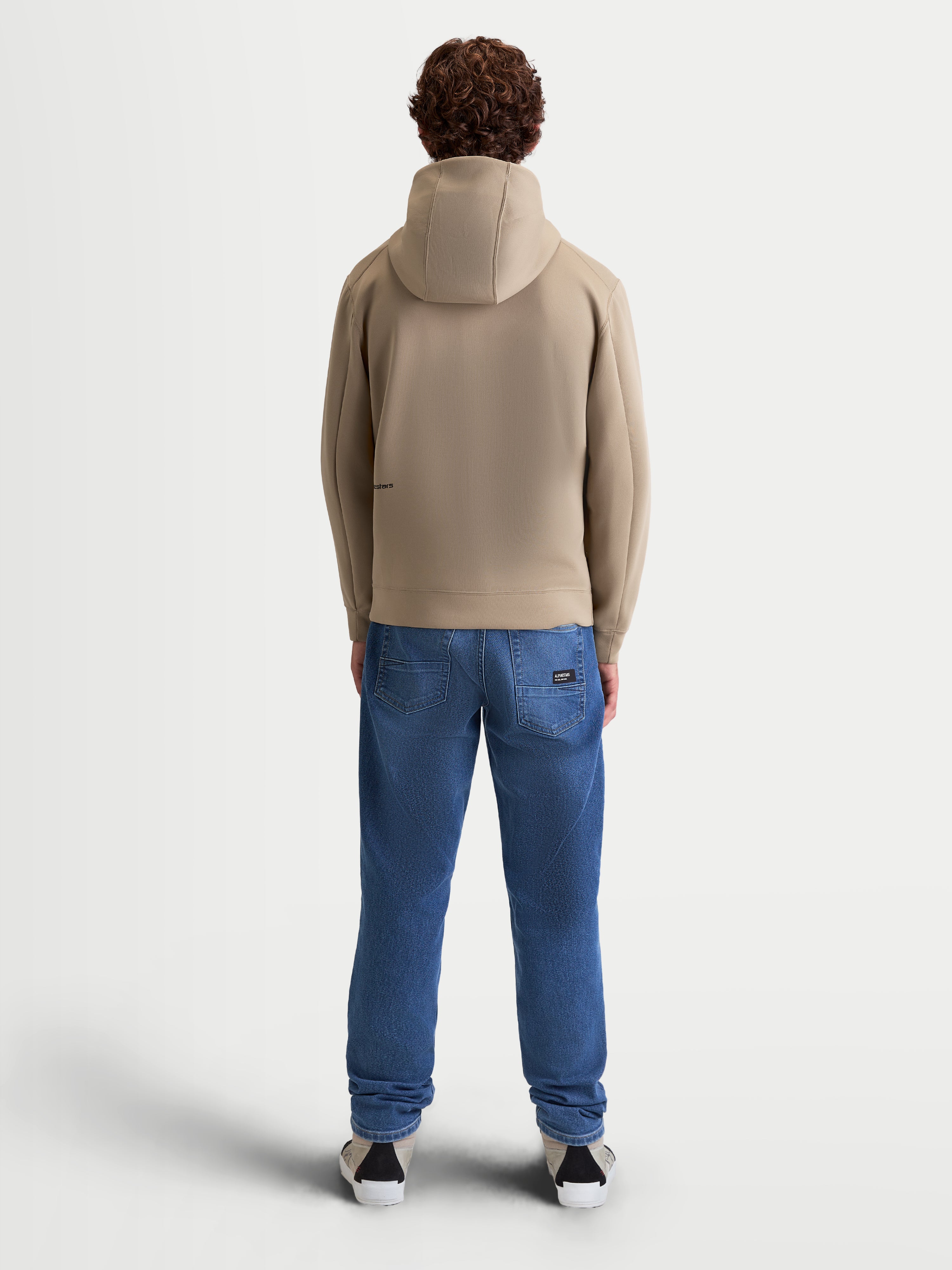 Alpinestars Cypher Hoodie, Sportswear Zip-Front Fleece for Men and Women, Putty Beige, Back View on Model, High-Neck Mesh-Lined Hood, Tri-Blend Performance Fabric, Motorsport-Inspired Casual Wear