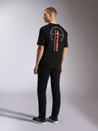 T-shirt Alpinestars Overhang Oversized CSF, t-shirt à manches courtes, noir, avec logo vertical rouge et motif blanc circulaire au dos, style streetwear décontracté motorsport