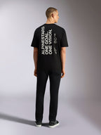 T-shirt Alpinestars One Oversized CSF, t-shirt à manches courtes, noir, impression verticale blanche au dos « ALPINESTARS ONE GOAL. ONE VISION. » avec logo Astars, style streetwear décontracté