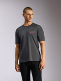 Alpinestars Pop Helmet CSF Tee, Short Sleeve T-Shirt, Charcoal Gray, worn by model, featuring black Astars logo with pink 'ALPINESTARS PROTECTS' text on the chest, casual motorsport streetwear