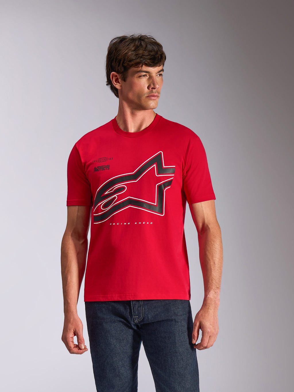 Alpinestars Authority CSF Tee, Short Sleeve T-Shirt, Red, large black and white outlined Astars logo on chest, worn by a male model with dark blue jeans, casual motorsport-inspired streetwear