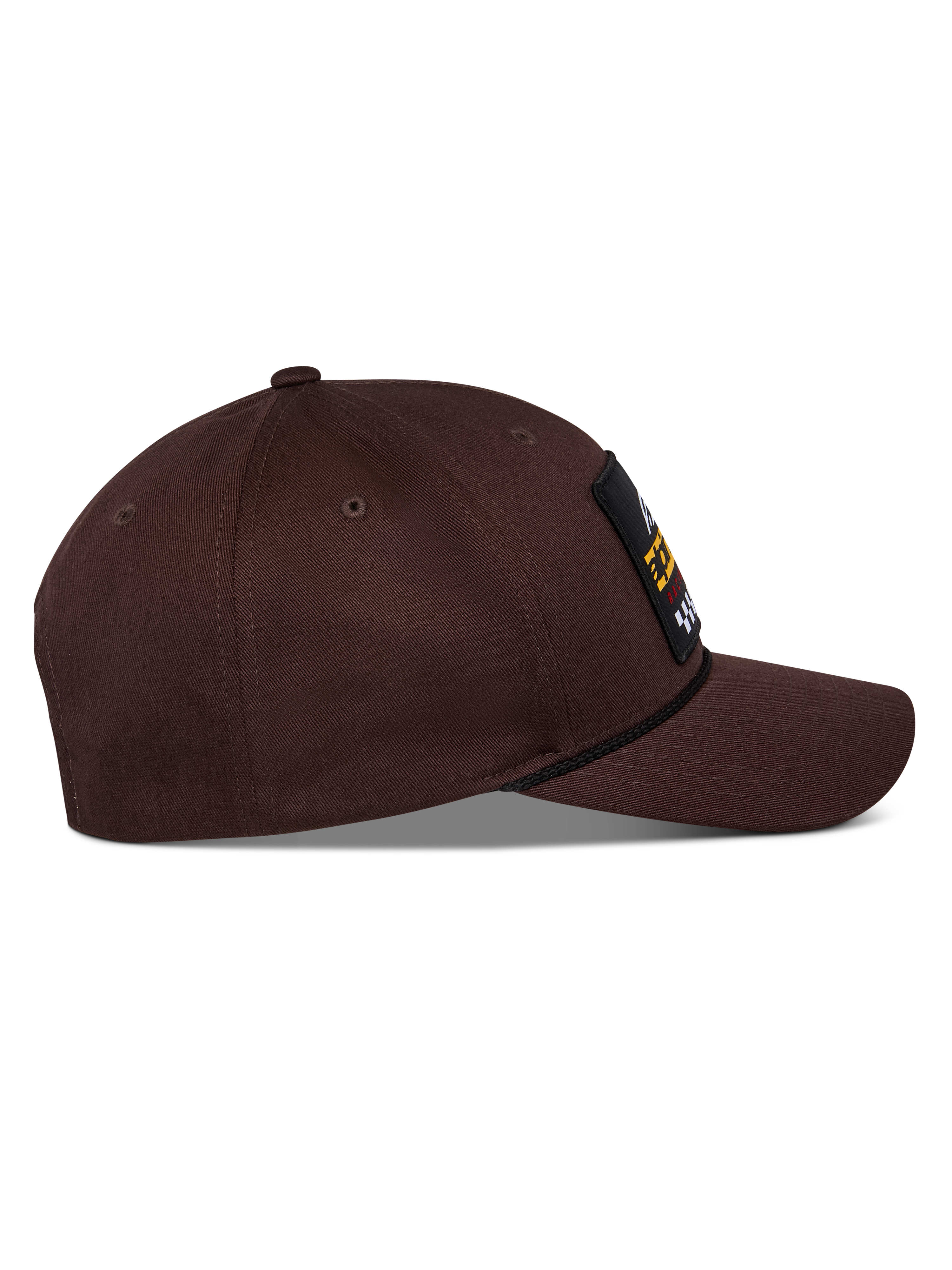 Casquette Matrix Snapback Alpinestars, marron foncé, vue latérale avec visière incurvée, couronne structurée et patch logo à l'avant avec détail de cordelette, casquette décontractée d'inspiration sport automobile