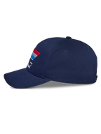 Casquette Snapback Alpinestars Trifecta, bleu marine, vue latérale, avec visière incurvée et graphisme à rayures tricolores avec texte blanc, couvre-chef casual motorsport