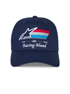 Casquette Snapback Alpinestars Trifecta, casquette bleu marine avec visière incurvée, logo brodé à l'avant avec étoile blanche et rayures tricolores, texte blanc 'Racing Ahead' et 'Goal One Vision', couronne structurée, couvre-chef décontracté d'inspiration sport automobile