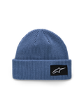 Bonnet Alpinestars Unload Rib Cuff, bleu, construction en maille jersey tricotée, coupe peu profonde avec revers, écusson tissé noir avec logo Astars blanc, accessoire sportswear décontracté