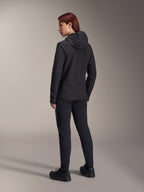 Alpinestars Stella A-Dura Thermal Jacket, Women's MTB cycling jacket, Black, back view highlighting the insulated hood and regular fit, worn with matching black pants and shoes, lightweight thermal insulation for cold-weather riding