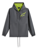 Veste coupe-vent Alpinestars Speeder Chromium, gris anthracite avec jaune haute visibilité, logo étoile vert citron sur la poitrine, capuche doublée de mesh, fermeture zippée intégrale avec cordon de serrage à l'ourlet, coupe-vent décontracté inspiré du sport automobile