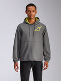 Alpinestars Speeder Chromium Windbreak Jacket, coupe-vent à capuche gris anthracite avec logo étoile jaune fluo, intérieur de capuche vert citron, poignets élastiques, cordons de serrage réglables, fermeture éclair frontale, style motorsport décontracté