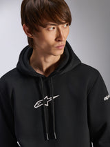 Sweat à capuche Frontal Alpinestars, sweat à capuche noir en polaire à enfiler, logo Astar blanc sur la poitrine et logo sur la manche, capuche à cordon, porté par un mannequin homme, style streetwear décontracté motorsport