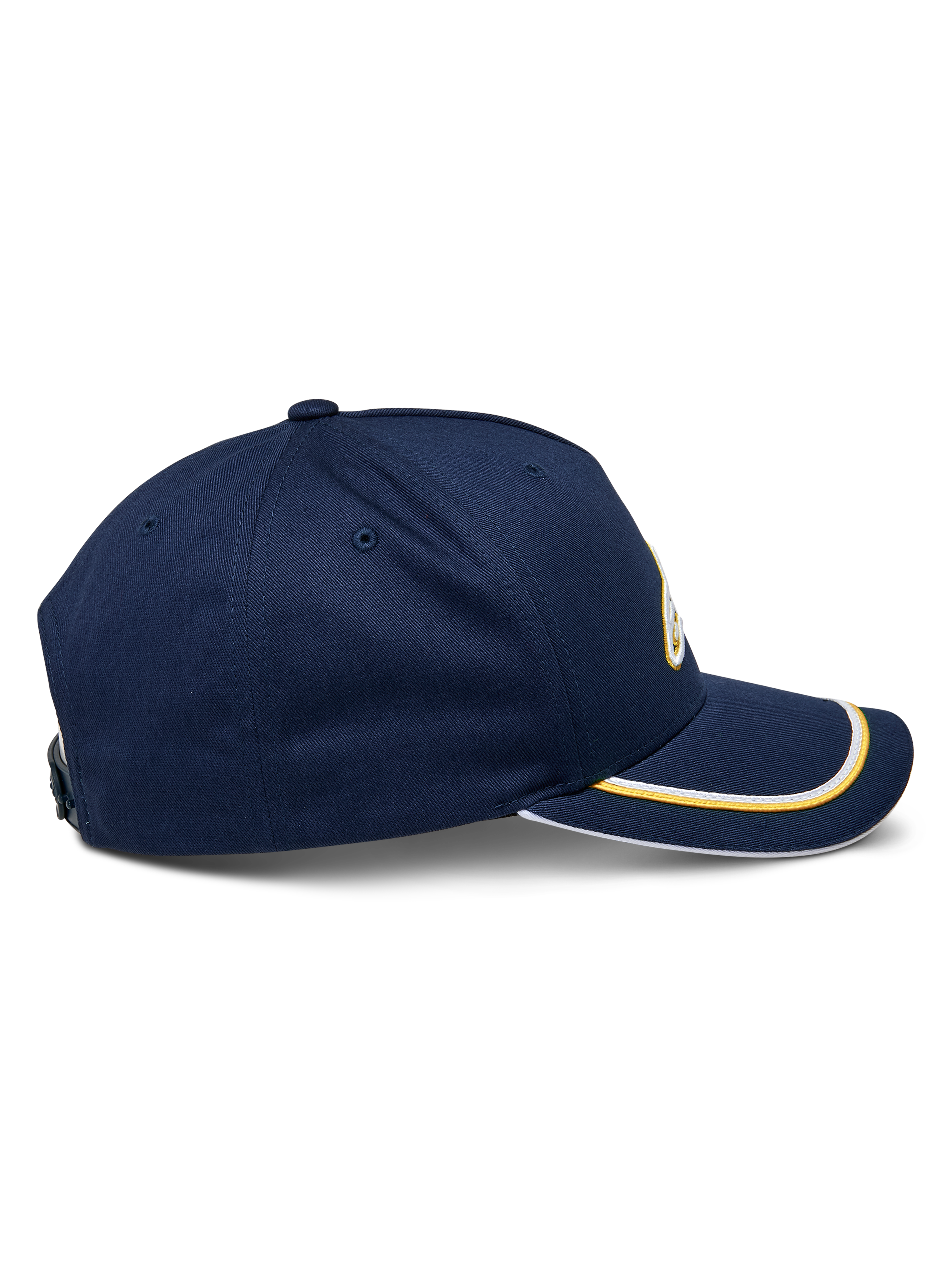 Casquette Snapback Ascension Alpinestars, vue de côté, bleu marine avec double passepoil sutache doré et blanc sur la visière courbée, couronne structurée, accessoire casual motorsport
