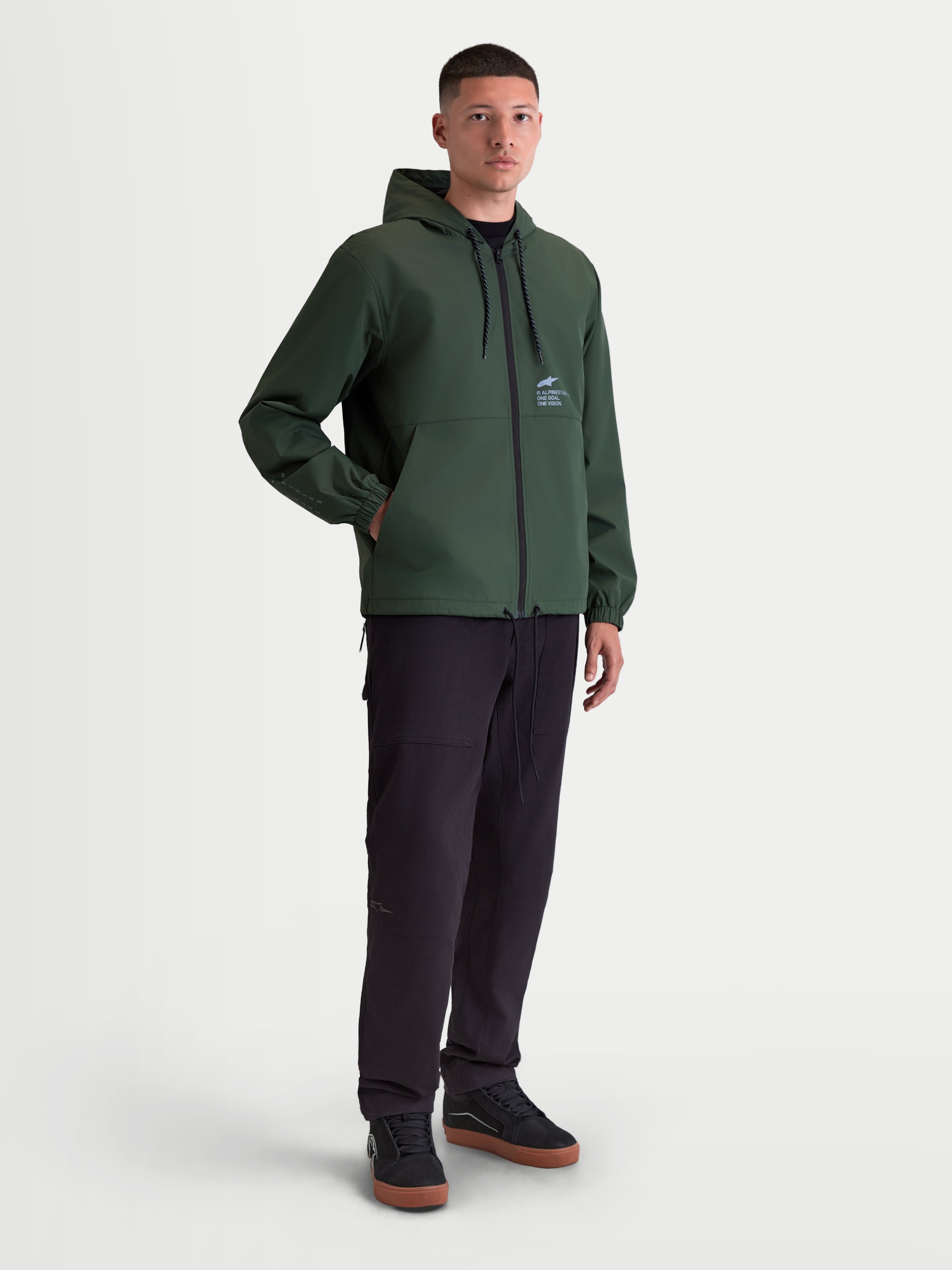Alpinestars Speeder Resolve Windbreaker Jacket, Lightweight Hooded Sportswear for Urban Use, Men, Pine Green, Polyester Construction, featuring mesh lining, adjustable hood and hem, and signature Alpinestars logo on chest.