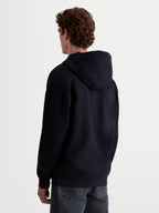 Alpinestars Prelude Oversized Hoodie, Sportswear Fleece Pullover, Unisex, Black, Back View showing the relaxed silhouette, self-lined hood, and ribbed hem and cuffs for a clean finish.