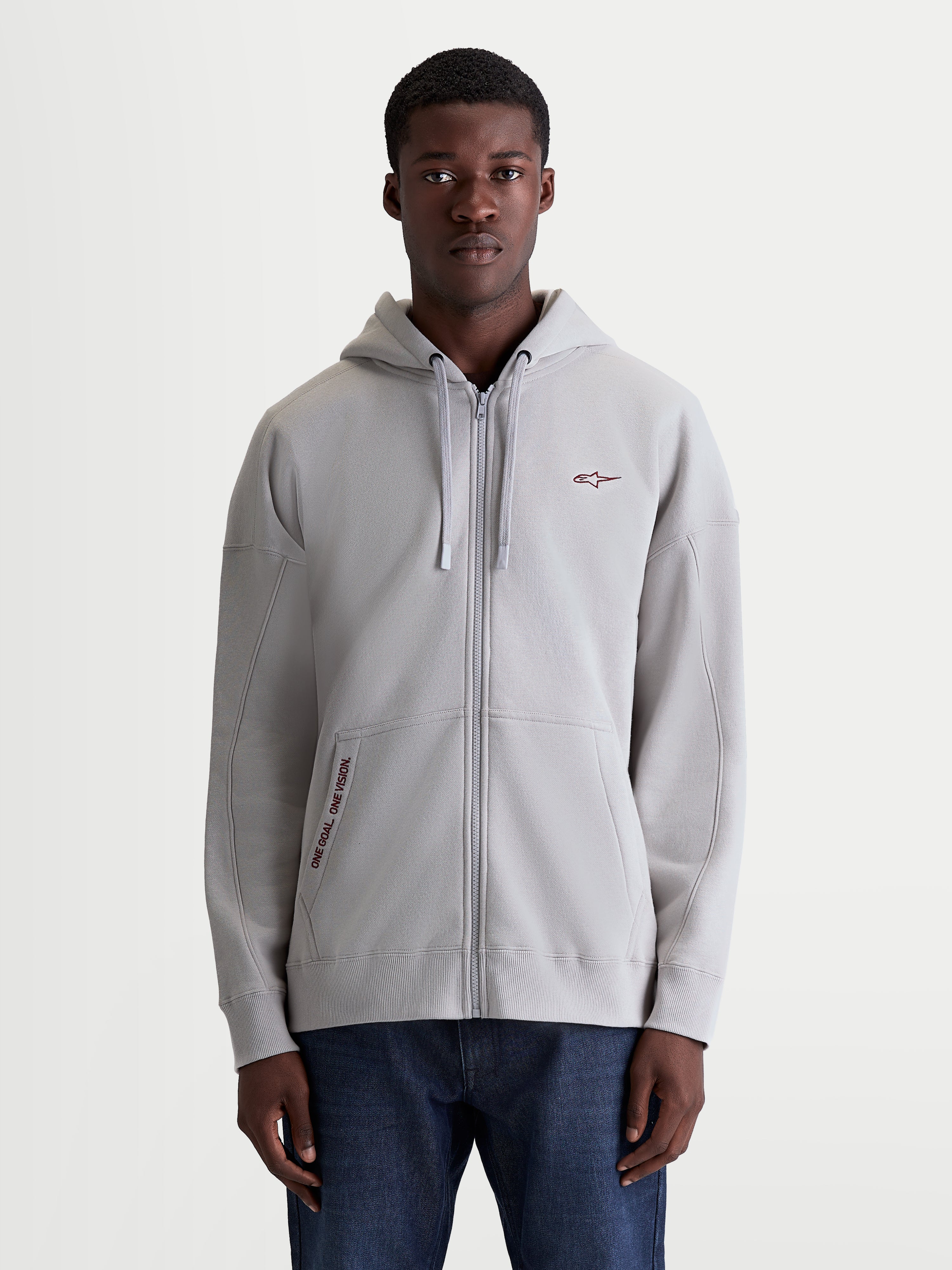 Alpinestars Sweat À Capuche Pioneer Oversized, sweat à capuche sportswear zippé pour homme, gris ciment, coupe oversize décontractée, fermeture éclair Vislon, poche kangourou avec broderie One Goal One Vision et logo sur la poitrine