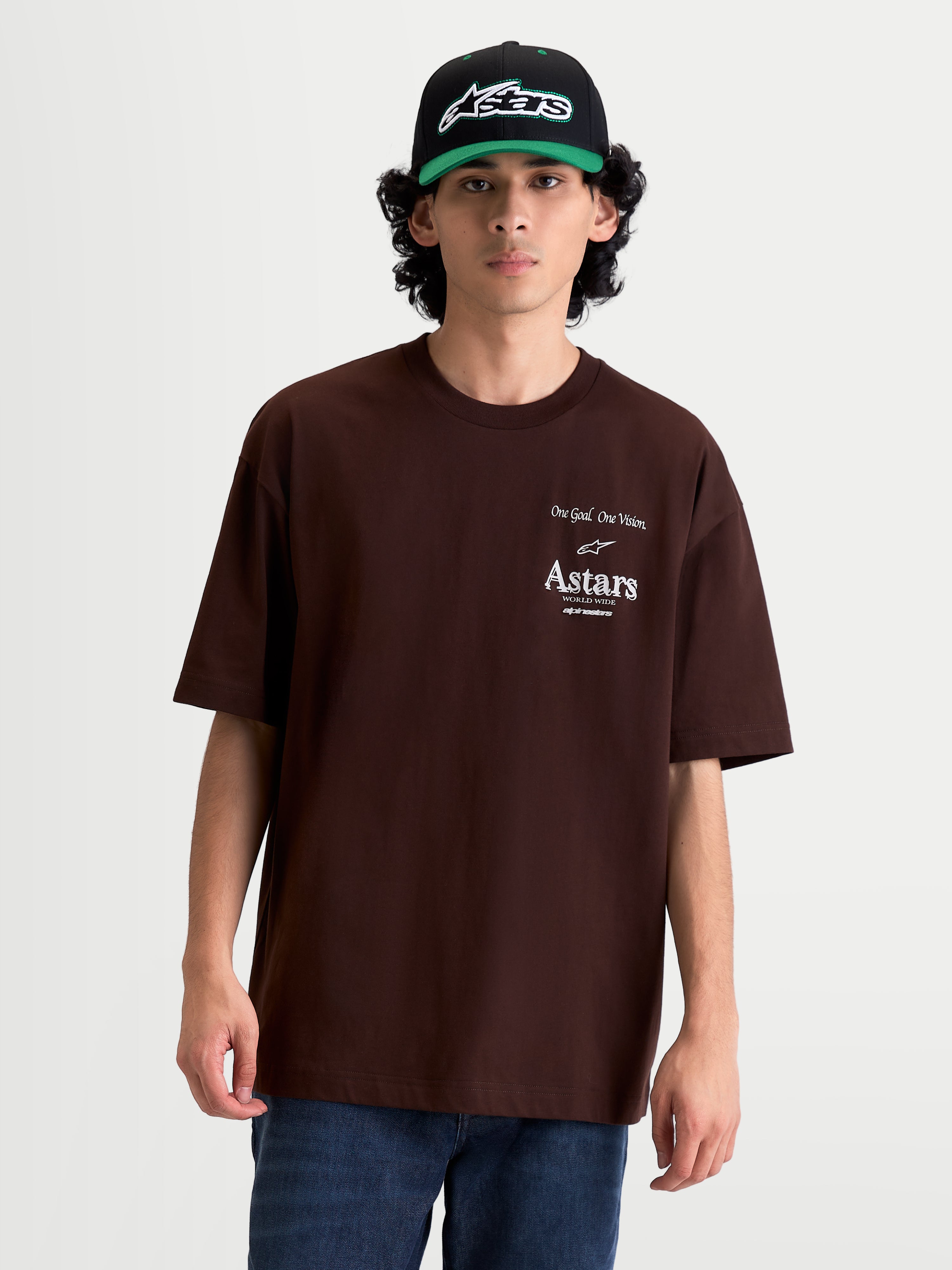 Alpinestars T-Shirt Post Oversized CSF, t-shirt sportswear à manches courtes pour homme, marron, coupe oversized décontractée, logos Astars et slogan One Goal. One Vision. imprimés en blanc sur le torse.