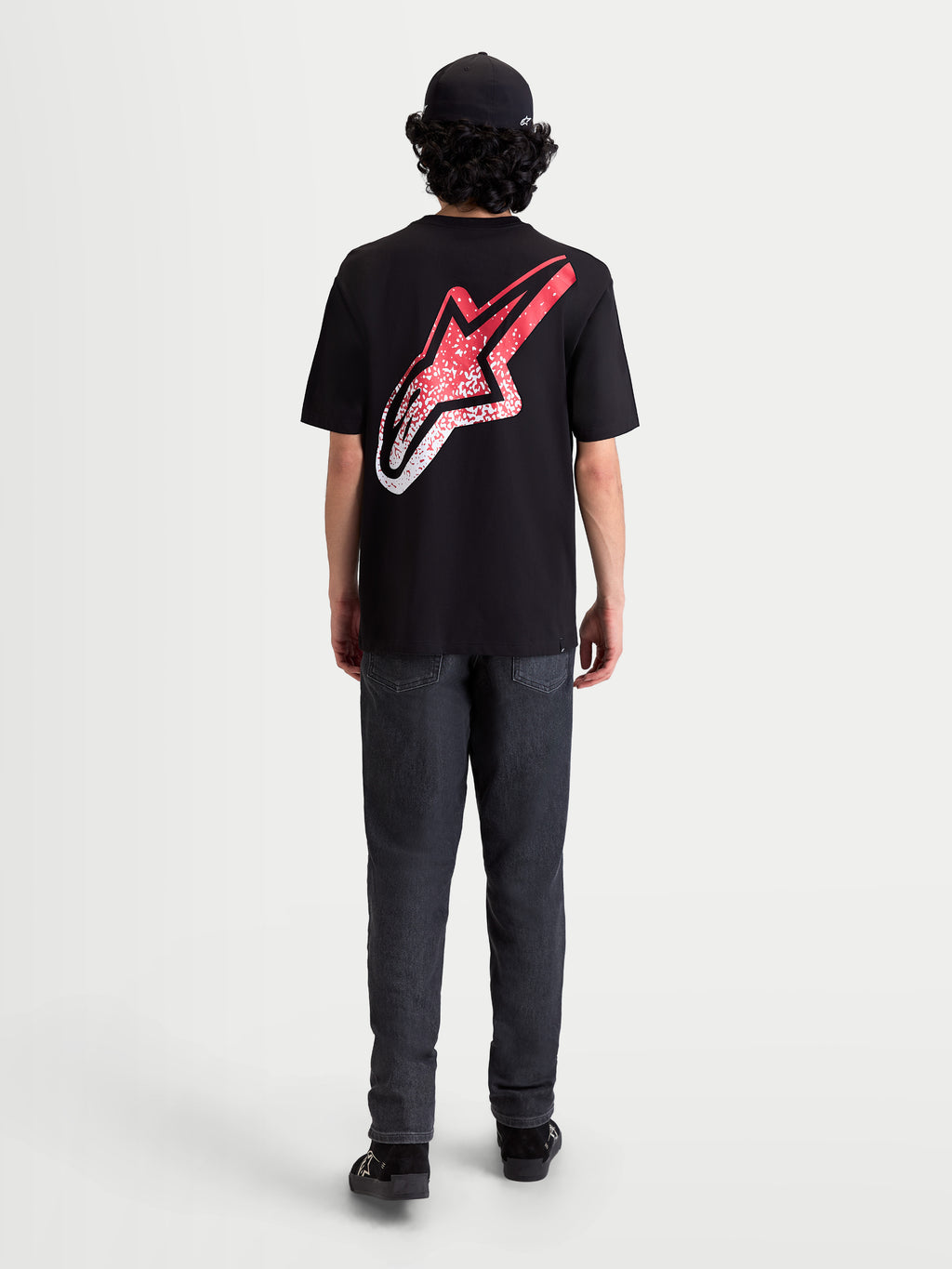 Alpinestars Meteor CSF, t-shirt de sportswear à manches courtes, noir, vue de dos sur mannequin avec un grand logo Astars et un graphique dégradé rouge et blanc inspiré du MX, style décontracté.