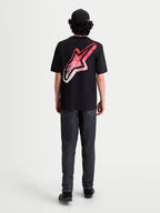 Alpinestars Meteor CSF, t-shirt de sportswear à manches courtes, noir, vue de dos sur mannequin avec un grand logo Astars et un graphique dégradé rouge et blanc inspiré du MX, style décontracté.