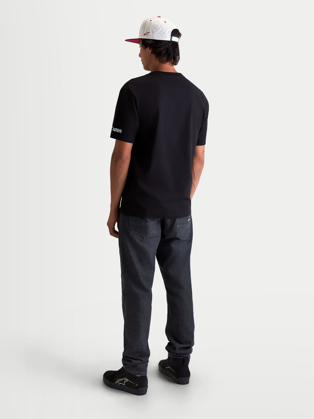 Alpinestars T-Shirt P1 CSF, t-shirt sportswear à manches courtes pour homme, noir, vue de dos montrant la coupe décontractée et le petit logo sur la manche
