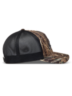 Alpinestars Thicket Realtree, casquette trucker camouflage et noire avec visière courbée et maille respirante, vue de profil.