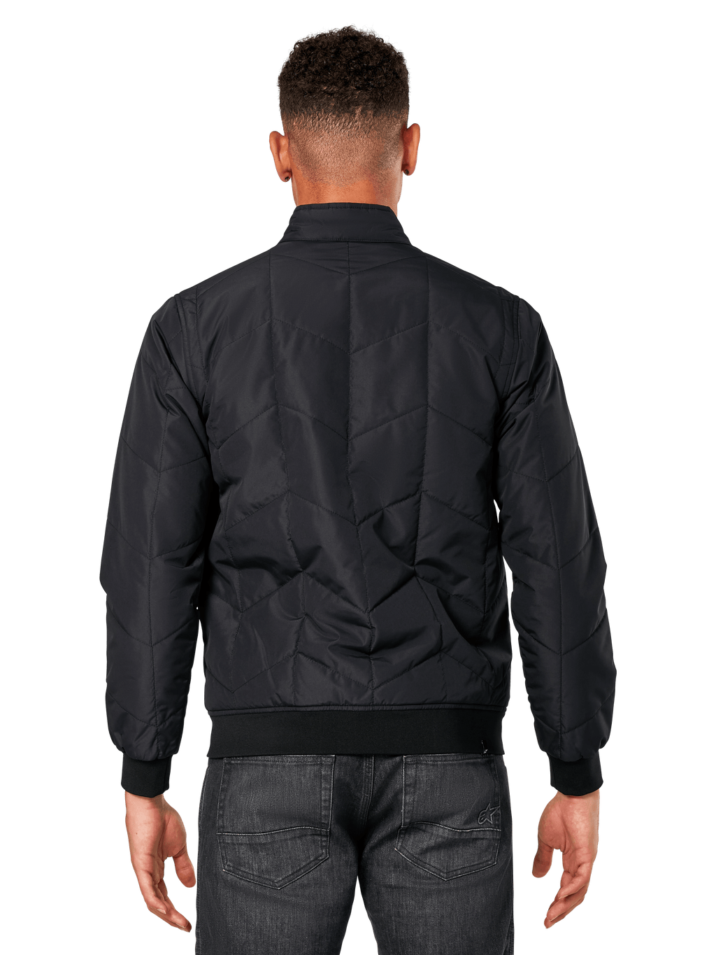 Veste Precedent Alpinestars, noir, vue de dos sur modèle, dotée d'un motif matelassé en angle iconique, poignets et ourlet en côtes, style motorsport matelassé inspiré de la F1