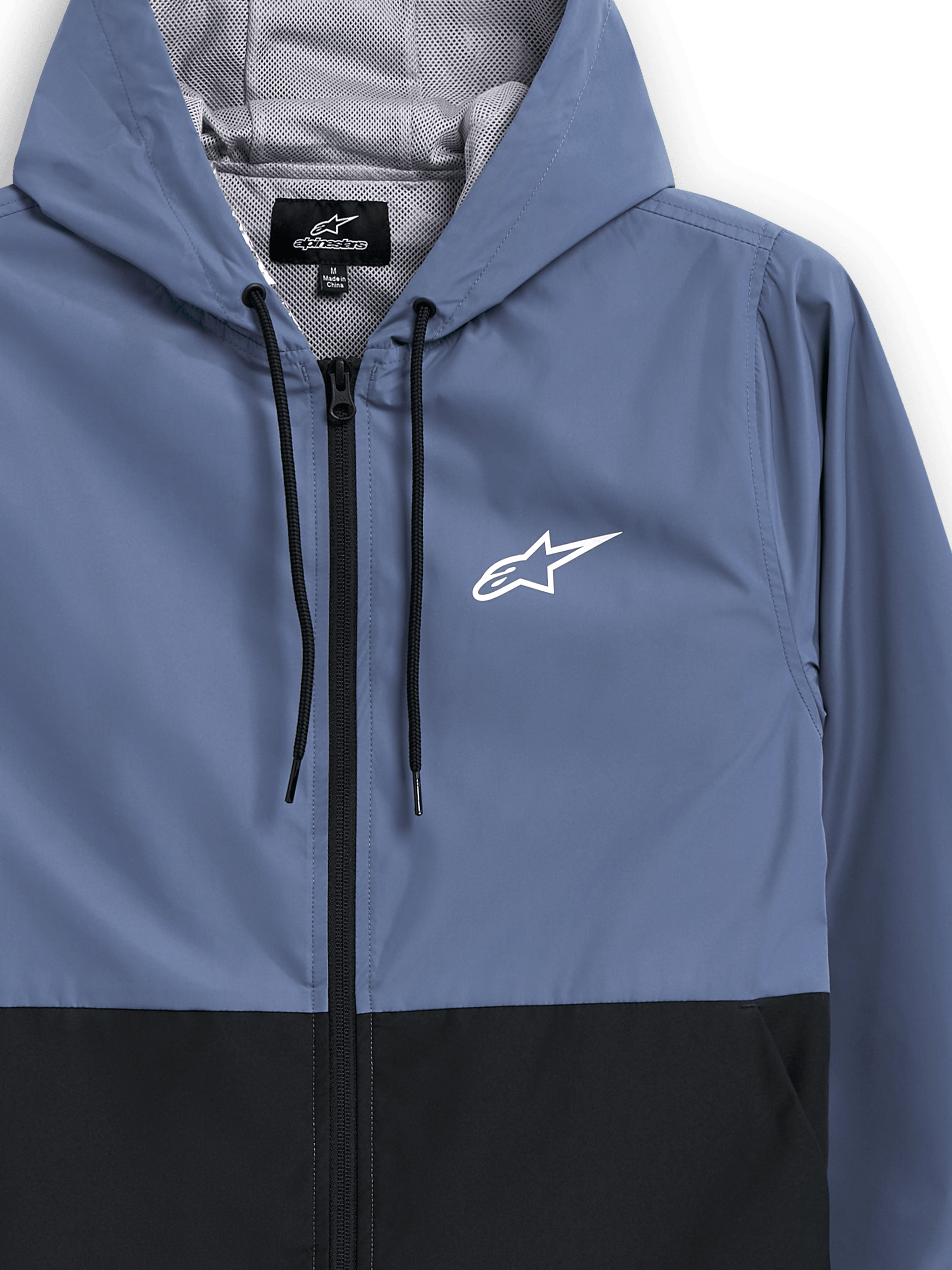 Veste coupe-vent Alpinestars Speeder, bleu ardoise et noir, coupe-vent léger à capuche, doublure en mesh avec cordons de serrage noirs, logo Alpinestars blanc sur la poitrine, design bicolore par blocs, streetwear décontracté d'inspiration sports mécaniques