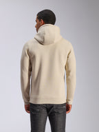 Sweat à capuche Alpinestars Ageless V3, blanc cassé, vue de dos, sportswear décontracté, doté d'une capuche doublée de jersey, manches longues avec poignets et ourlet côtelés, porté avec un jean en denim foncé