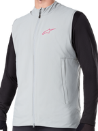 Alpinestars A-Dura Thermal Vest, Titanium Gray insulated cycling gilet, featuring a pink star logo on the chest, worn over a black long-sleeve top, includes a vertical zippered pocket and full front zip, designed for cold-weather mountain bike trail riding.