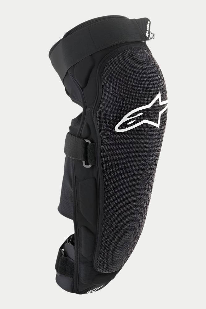 Protection genou/tibia Alpinestars Vector Pro, noir, avec un logo Alpinestars blanc sur le genou, panneau avant texturé résistant à l'abrasion, sangles à scratch réglables, équipement de protection VTT respirant