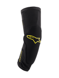 Genouillères Alpinestars Paragon Plus, noires avec logos jaune acide, équipement de protection pour VTT, manchon tubulaire à enfiler avec rembourrage intégré, maille respirante et tissu texturé durable
