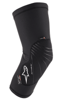 Alpinestars Paragon Lite Knee Protector, Black, lightweight protective gear with textured mesh construction, white logo, gray design lines, slip-on sleeve design, featuring CE Level 1 and Polygiene tags, designed for MTB and off-road cycling