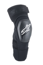 Alpinestars A-Impact Plasma Elite Shield, genouillères de protection, noires avec logo étoile blanc, coque extérieure rigide en TPU, tissu mesh avec sangle supérieure ajustable, design ergonomique pré-courbé, protection VTT et tout-terrain