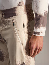 Alpinestars A-Dura Ride Shorts in sand camo, featuring zippered pockets and durable stretch fabric for MTB riding.