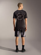 Short VTT A-Dura Ride Black Camo, modèle extensible 4 directions pour homme, vue de dos en studio.