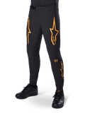 Alpinestars A-Supra Race Pants, Black with orange star graphics, MTB racing pants featuring laser-perforated ventilation and ratchet waist closure, slim performance fit for off-road cycling