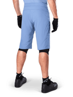 Alpinestars A-Dura Shorts, Infinity Blue mountain bike shorts, back view, paired with black gloves, knee liners, and black socks with white star logo, durable stretch material for off-road cycling