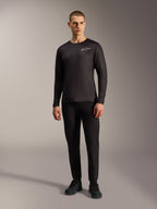 Maillot VTT noir A-Dura Air à manches longues, haut respirant avec logo Alpinestars blanc porté par un mannequin.