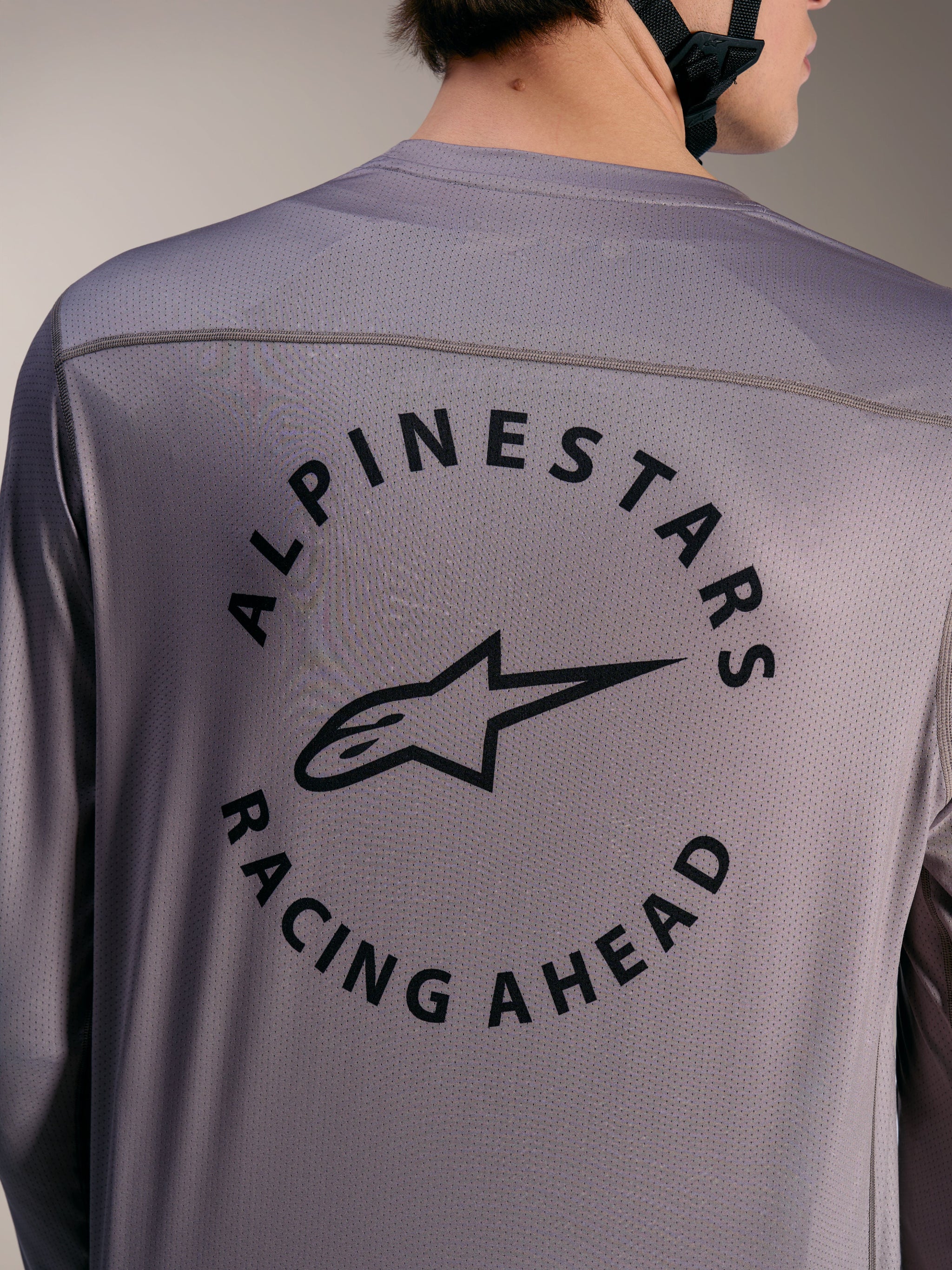 Gray A-Dura Air Long Sleeve Jersey back view, circular Alpinestars Racing Ahead graphic on breathable mesh fabric.