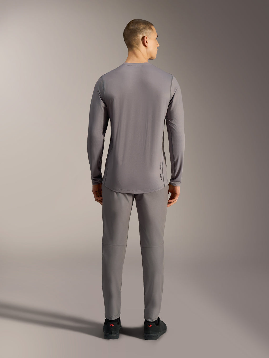 Alpinestars A-Dura Ride Long Sleeve Jersey in Gray, performance MTB top with jacquard stretch fabric and a dropped tail.