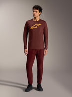 Maillot à manches longues A-Dura Ride bordeaux, logo Alpinestars jaune, pantalon assorti pour le VTT trail.