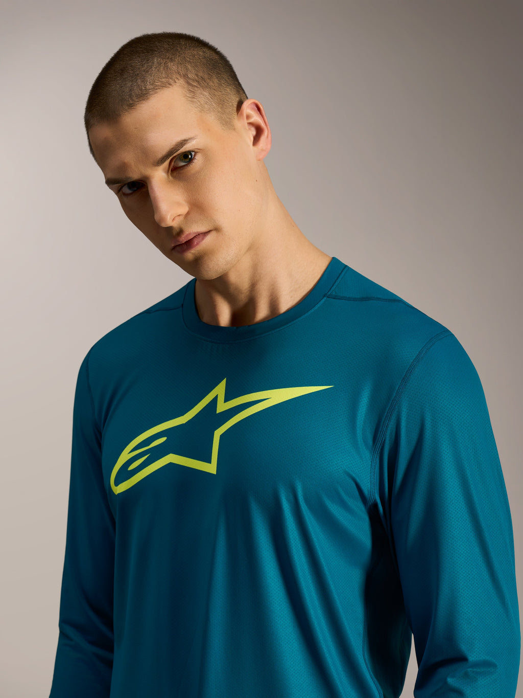 Maillot manches longues A-Dura Ride bleu-vert avec logo Alpinestars lime, vêtement technique VTT de performance.