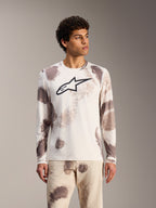 Maillot VTT manches longues Alpinestars A-Dura Ride Sand Camo, blanc à motifs abstraits et logo noir sur la poitrine.