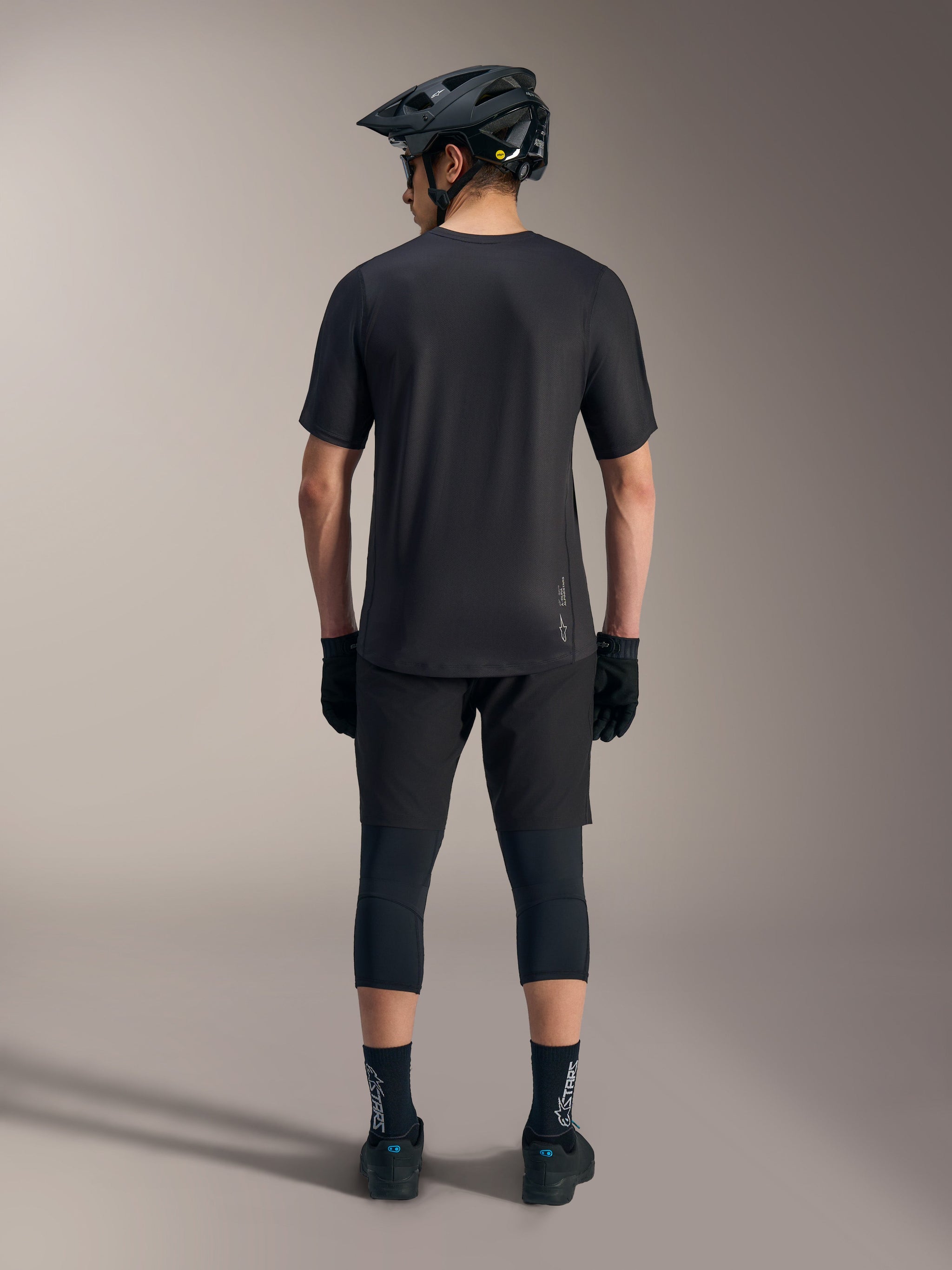 A-Dura Ride Short Sleeve Jersey in black, rear view showing performance drop tail and subtle Alpinestars branding.
