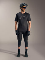 Black A-Dura Ride Short Sleeve Jersey with a silver chest logo, shown with a full Alpinestars MTB riding kit.