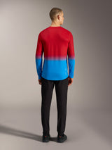 Alpinestars A-Dura ASTARS 2.0 long sleeve MTB jersey in bright red and blue gradient, back view on model.