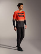 Maillot A-Dura ASTARS 2.0 orange et noir à manches longues avec logo audacieux, conçu pour la performance VTT.