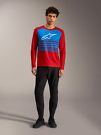 Maillot A-Dura Elite 2.0 rouge, haut VTT à manches longues avec panneau bleu, logo Alpinestars blanc et détails rayés.