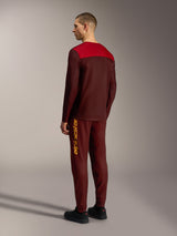 Maillot Alpinestars A-Dura Elite 2.0 bordeaux et rouge, manches longues, vue de dos d'un vêtement technique de VTT.