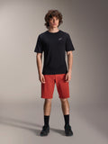 Alpinestars A-Dura Elite Shorts, MTB Mountain Biking Shorts, Dark Orange, worn with a black short-sleeved jersey and cycling shoes, performance cycling apparel for mountain biking