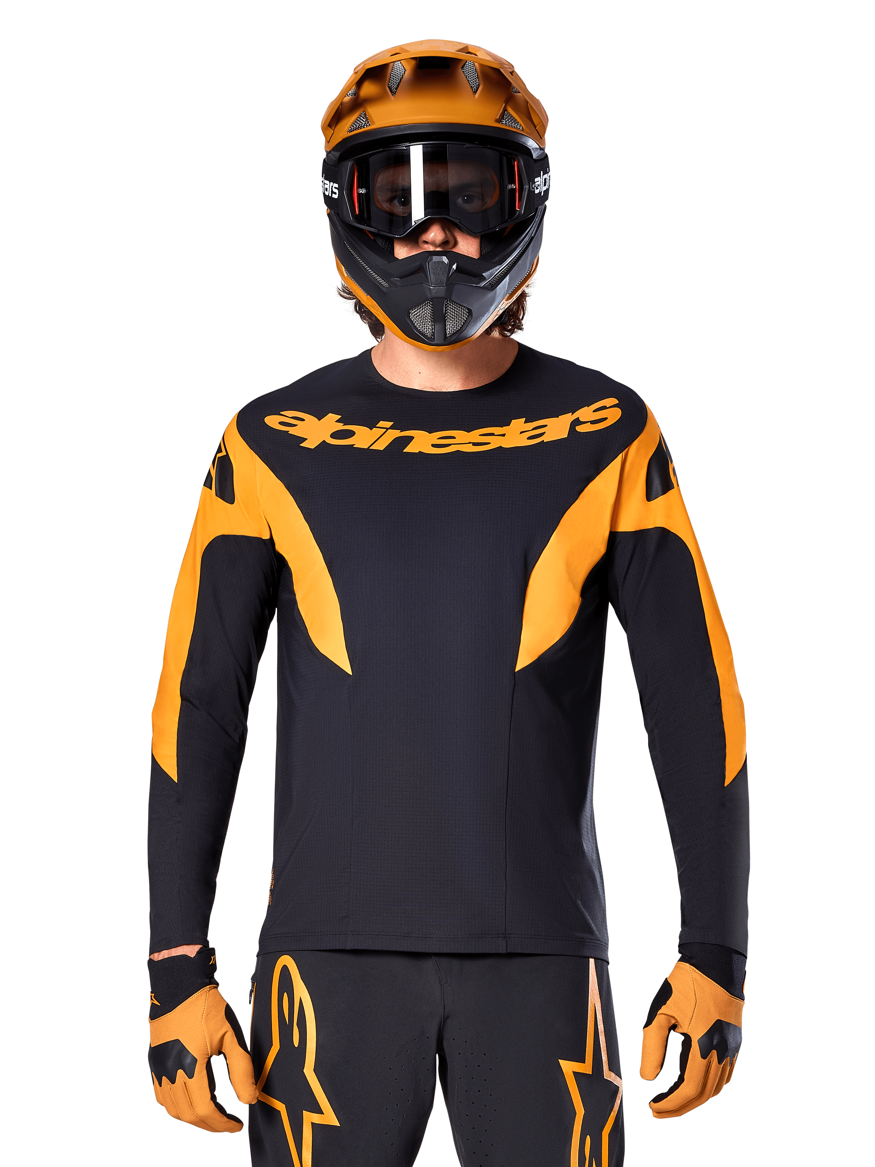 MTB rider wearing Alpinestars A-Supra Race Jersey - Long Sleeve, Black with orange graphics and chest logo, worn with matching orange full-face helmet, black goggles, and orange gloves, coordinated racing kit for mountain bike performance
