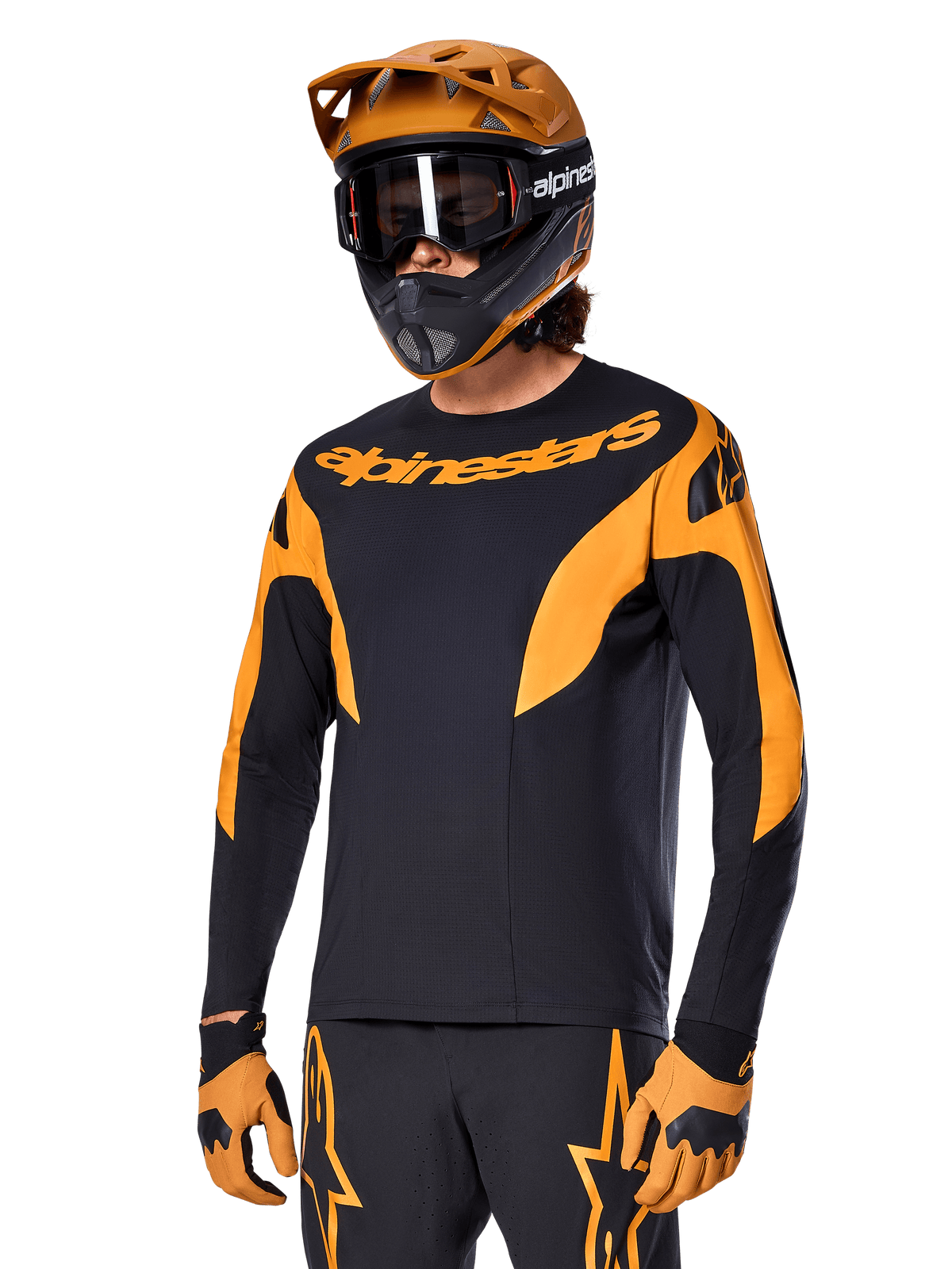 Alpinestars A-Supra Race Jersey - Long Sleeve, MTB Cycling Jersey, Black and Orange, worn with matching helmet and gloves, featuring Alpinestars branding on chest and stylized accents on sleeves, performance fit for off-road racing