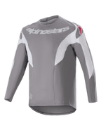 Maillot Alpinestars A-Supra Race, maillot de VTT à manches longues, gris foncé avec empiècements blancs, logo Alpinestars blanc sur la poitrine et logos étoiles rouges sur les épaules, tissu technique micro-perforé avec coupe plus longue à l'arrière pour le cyclisme tout-terrain